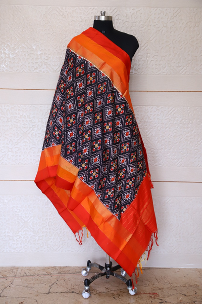 Single ikat dupatta in traditional Paan Chanda design in Black and Orange combination