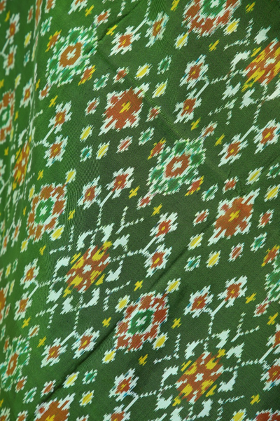 Single ikat dupatta in traditional Navratna design in Parrot Green and Red combination
