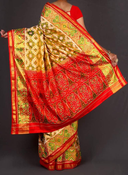 Red Pallu off white with green Patola Saree