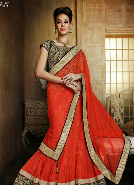 Artistic orange designer lehenga with unique blouse - New India Fashion